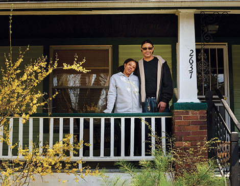 A couple on their front porch during the pandemic A couple on their front porch during the pandemic