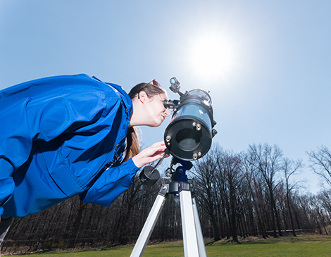 A woman preparing to view the eclipse