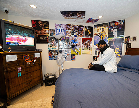 LeBron James sitting in a re-creation of his childhood bedroom at LeBron James' Home Court LeBron James sitting in a re-creation of his childhood bedroom at LeBron James' Home Court