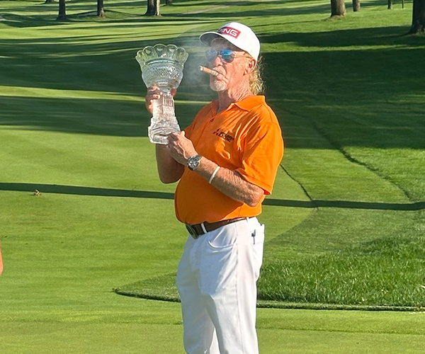 Miguel Angel Jimenez holding the trophy at Firestone Country Club