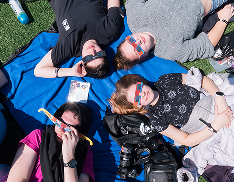 People view the eclipse through their glasses