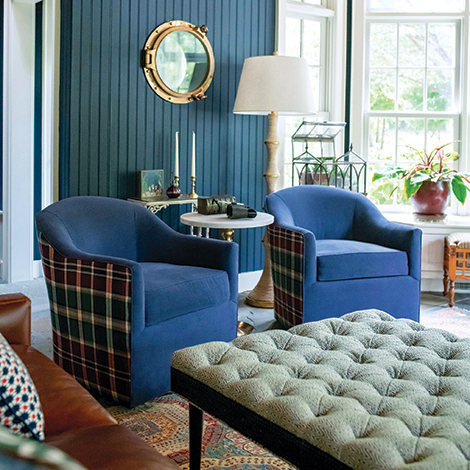 The two blue chairs with patterned exteriors.