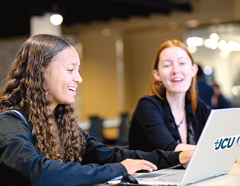 Two students at John Carroll University taking part in online learning Two students at John Carroll University taking part in online learning