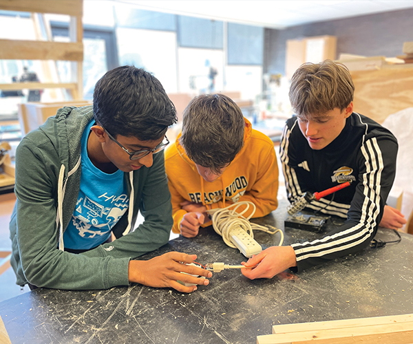 Three students working together