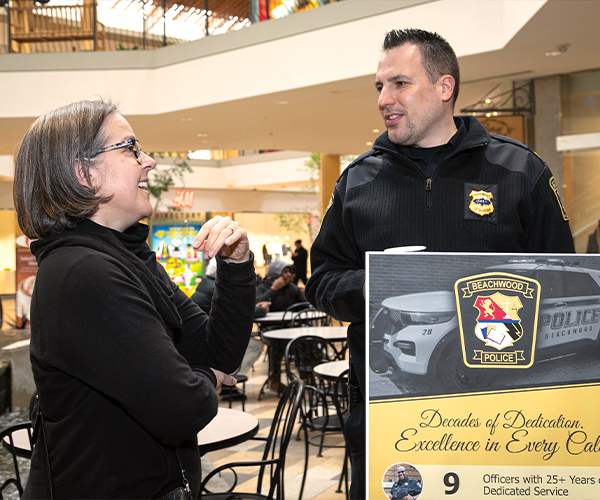 Police Chief Daniel Grispino speaking with resident