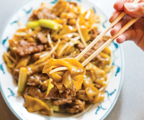 Beef chow ho fun plated