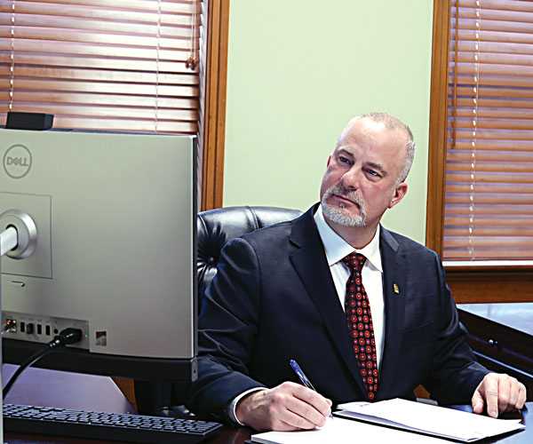 Brecksville mayor Daryl Kingston sitting at his desk