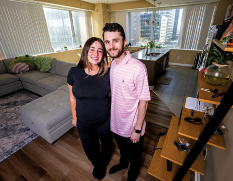 470x365_Article-1 Ally Costello standing in her Downtown Cleveland apartment