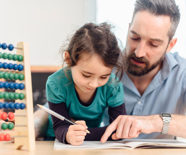 Father and Daughter Writing