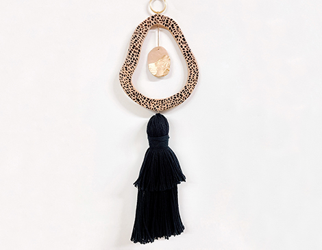 Part of a 14-piece collection, this totem stands out among other wall hangings and paintings. Part of a 14-piece collection, this totem stands out among other wall hangings and paintings.