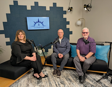 beachwood-article three adults sitting behind podcast microphones to record the Beachwood, Ohio business podcast