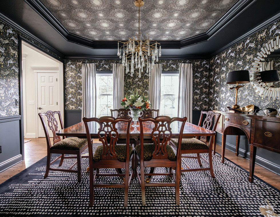 An elegant dining room with a wallpapered ceiling