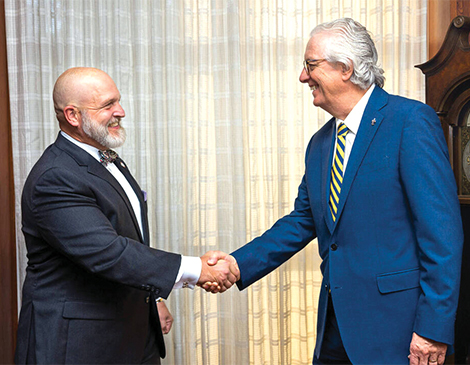 Walter Iwanenko and David King shaking hands