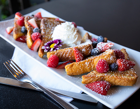 Executive chef Paul Mendolera often incorporates edible flowers into his dishes, such as the French toast served during the weekend brunch.