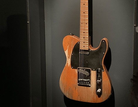 The Boss' 1953-54 guitar was featured on the cover of Born to Run (ital) and now lives in the middle of the museum's most expansive exhibit.