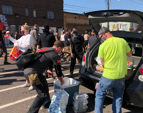 Volunteer medics hand out water and snacks at Tuesday's protest.