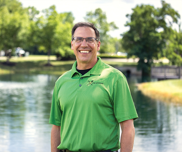 Mayor Rocco Yeargin in front of pond
