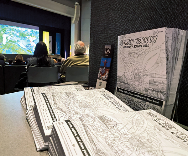 Copies of Green Visionary Activity Book stacked up