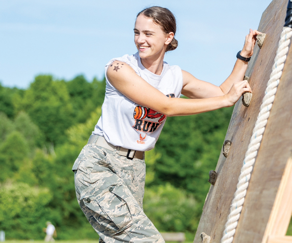 ROTC participant Keely Bahry climbing a rope