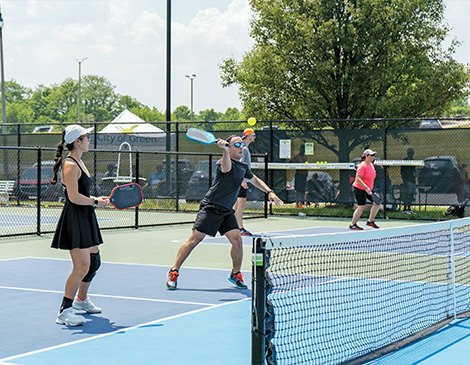 People playing pickleball in Green