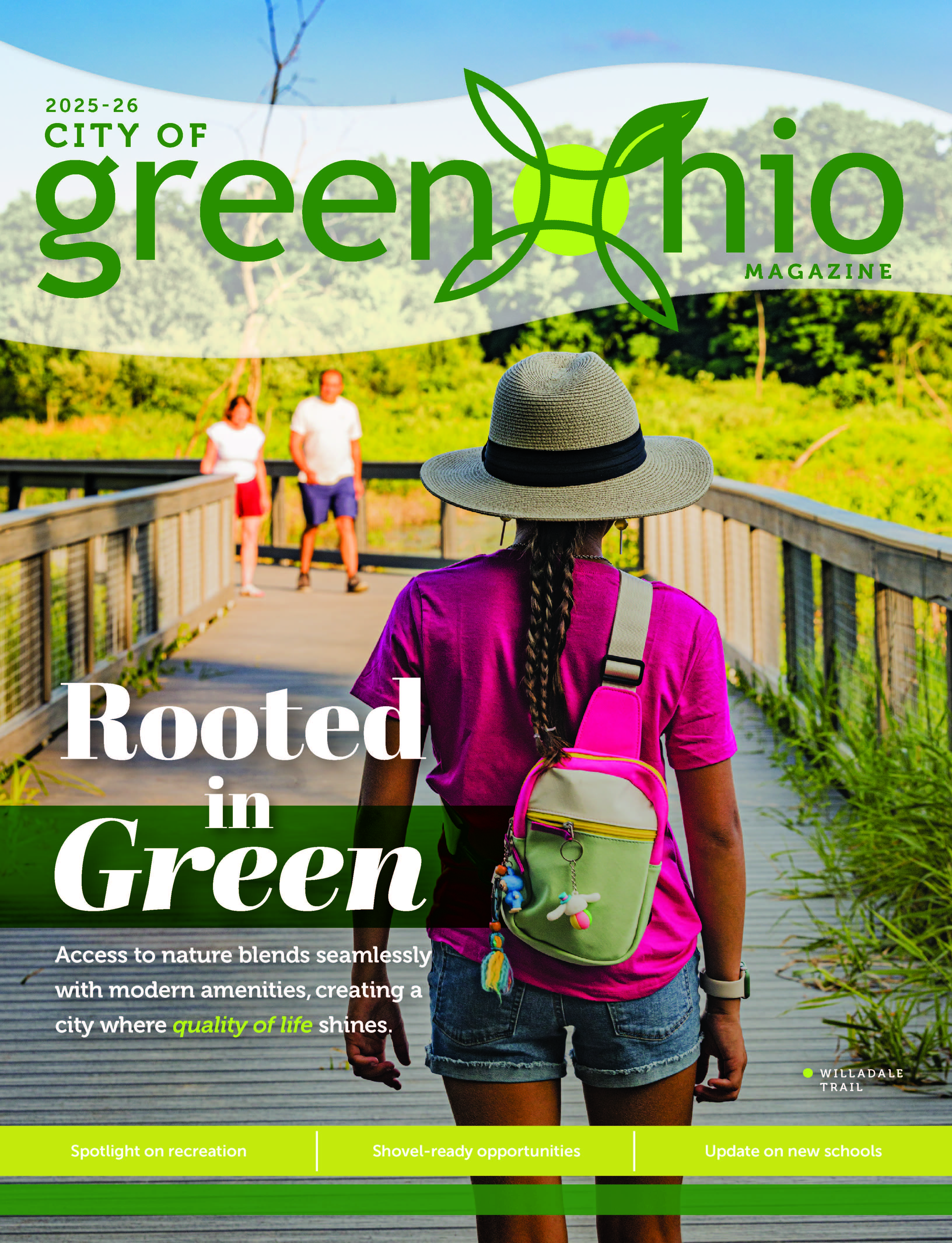 Woman standing on boardwalk in park on magazine cover