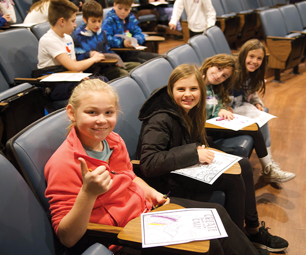 Students sitting in auditorium