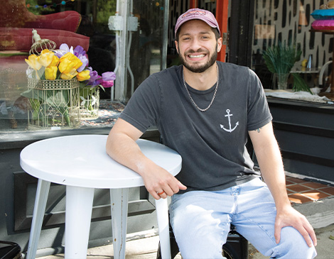 Brewella's Coffee owner sits in front of shop in Lakewood