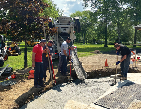 Workers pouring concrete