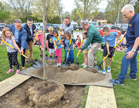 Kids participating in tree planting