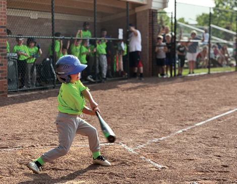 middleburg-heights-community-center-baseball-article a young baseball player hitting the ball at the Middleburg Heights Community Center
