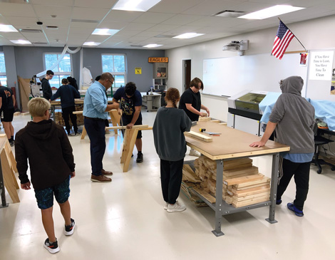 15-skills-class-article high school students in a workshop classroom learning to use tools