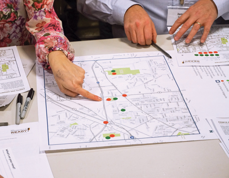 north-ridgeville-master-plan-article two sets of hands pointing to a map and reviewing documents