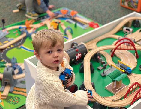 kids-article a child playing with trains
