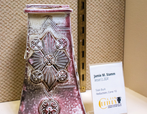 library-article a reddish pink piece of pottery by Jamie M. Stamm