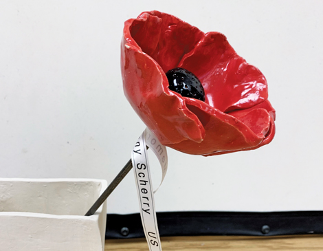 A ceramic poppy flower