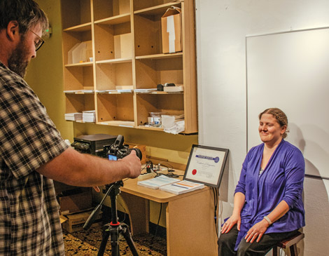 A woman posing for a passport photo