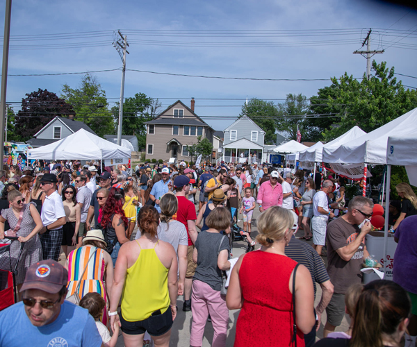A crowd of people at a summer event
