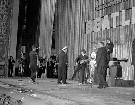 Cleveland Police force the Beatles off stage in the band's first appearance in 1964.
