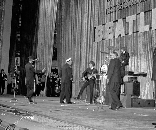 Cleveland Police force the Beatles off stage in the band's first appearance in 1964.