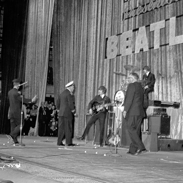 Cleveland Police force the Beatles off stage in the band's first appearance in 1964.