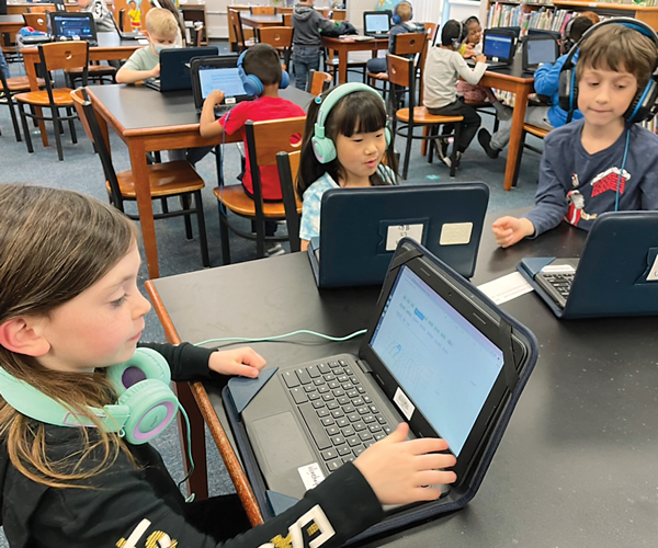 Young students of Solon schools using laptops