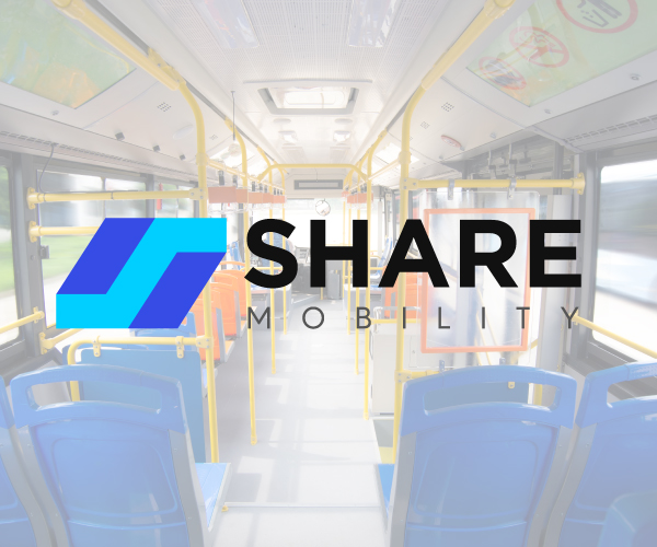 The Share Mobility logo over a photo the inside of a bus