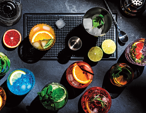 solon-sips-snacks-article an overhead shot of various cocktails and drink-making tools