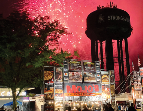 Red fireworks light up the sky above Strongsville's Rib Burnoff