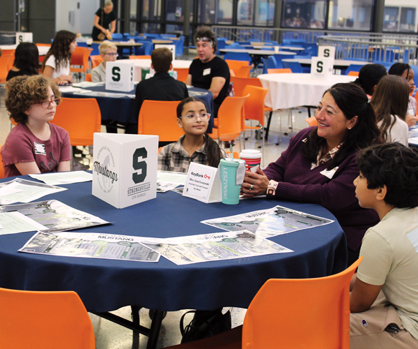 Strongsville students meeting with a local business leader