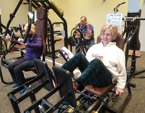 westlake-senior-servies-fitness-room-article A group of people utilizing the exercise machines in the Westlake Senior Services Fitness Room