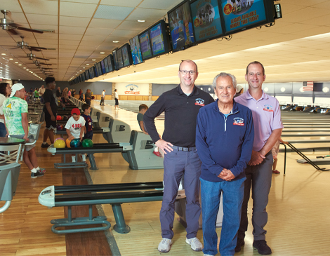 Wickliffe Lanes owners standing in bowling alley