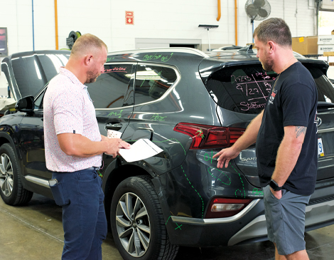 people working on a car