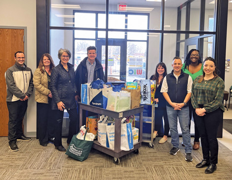 wwlc-chamber-cares A group of Willoughby Western Lake County chamber members standing with bags of donations